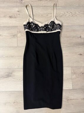 Form fitting boutique Black Midi Dress with Cream Lace Bodice